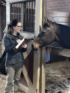 Joan talking to barn horse 2025
